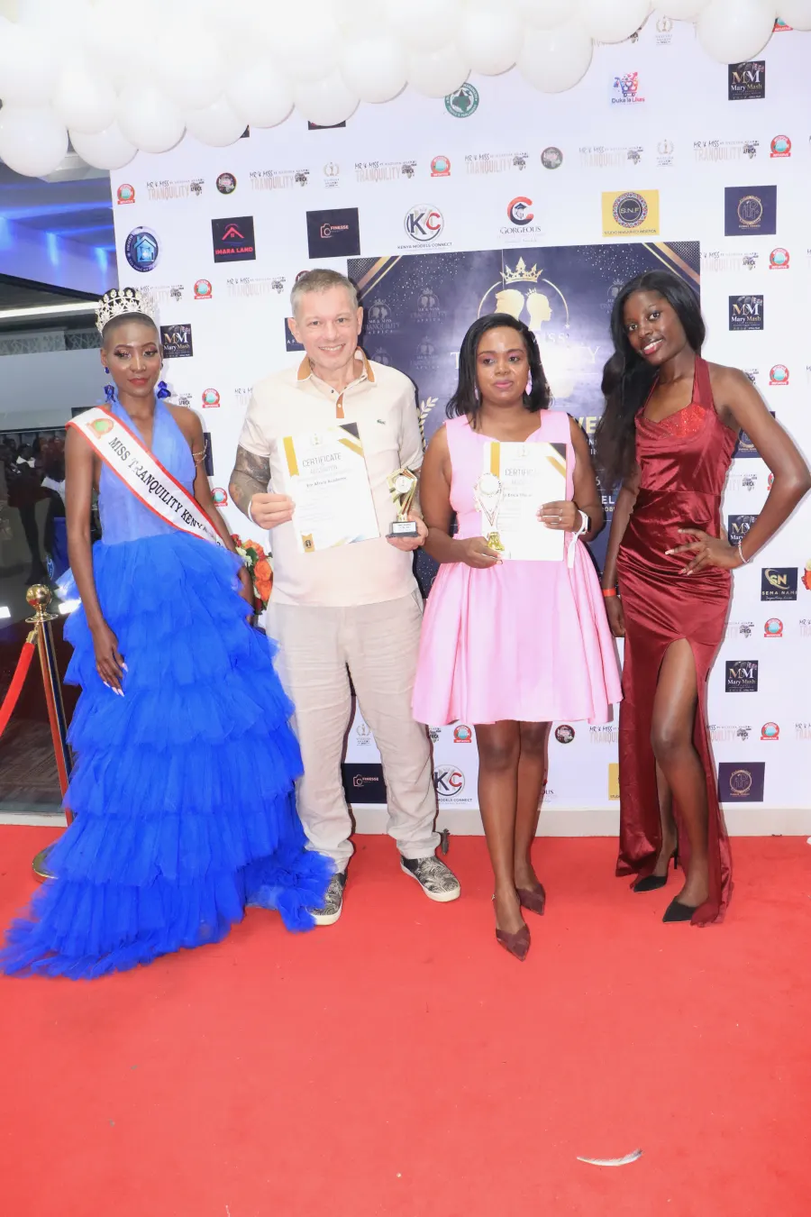 EM Africa team and models celebrating an award